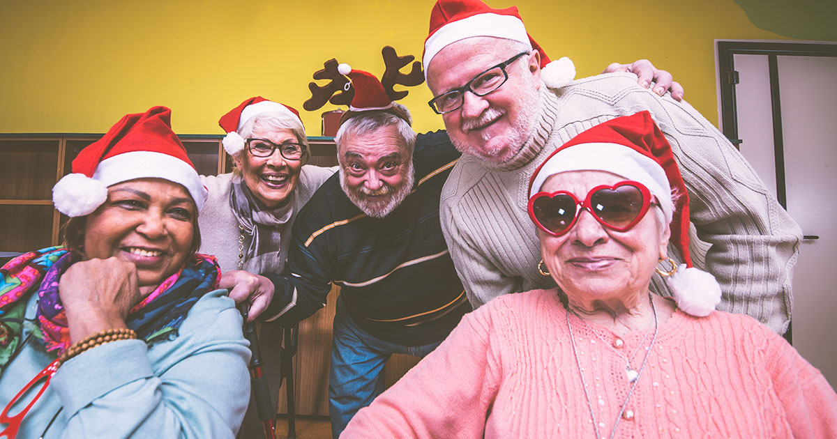 Group of seniors providing dementia support with group activities during Christmas